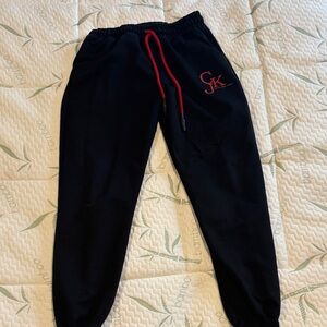 Calvin Klein Kids Black Sweatpants with Red Drawstring & Logo